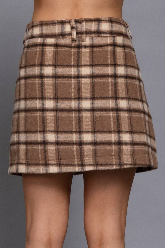 A brown and beige plaid mini skirt, shown on a model from the back against a solid gray background.