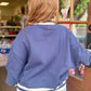 Back view of navy blue Southern graphic sweatshirt with white striped ribbed trim and relaxed oversized fit